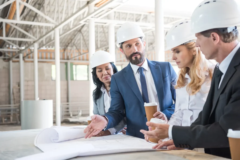 group of contractors in formal wear talking while 2024 11 19 04 53 45 utc